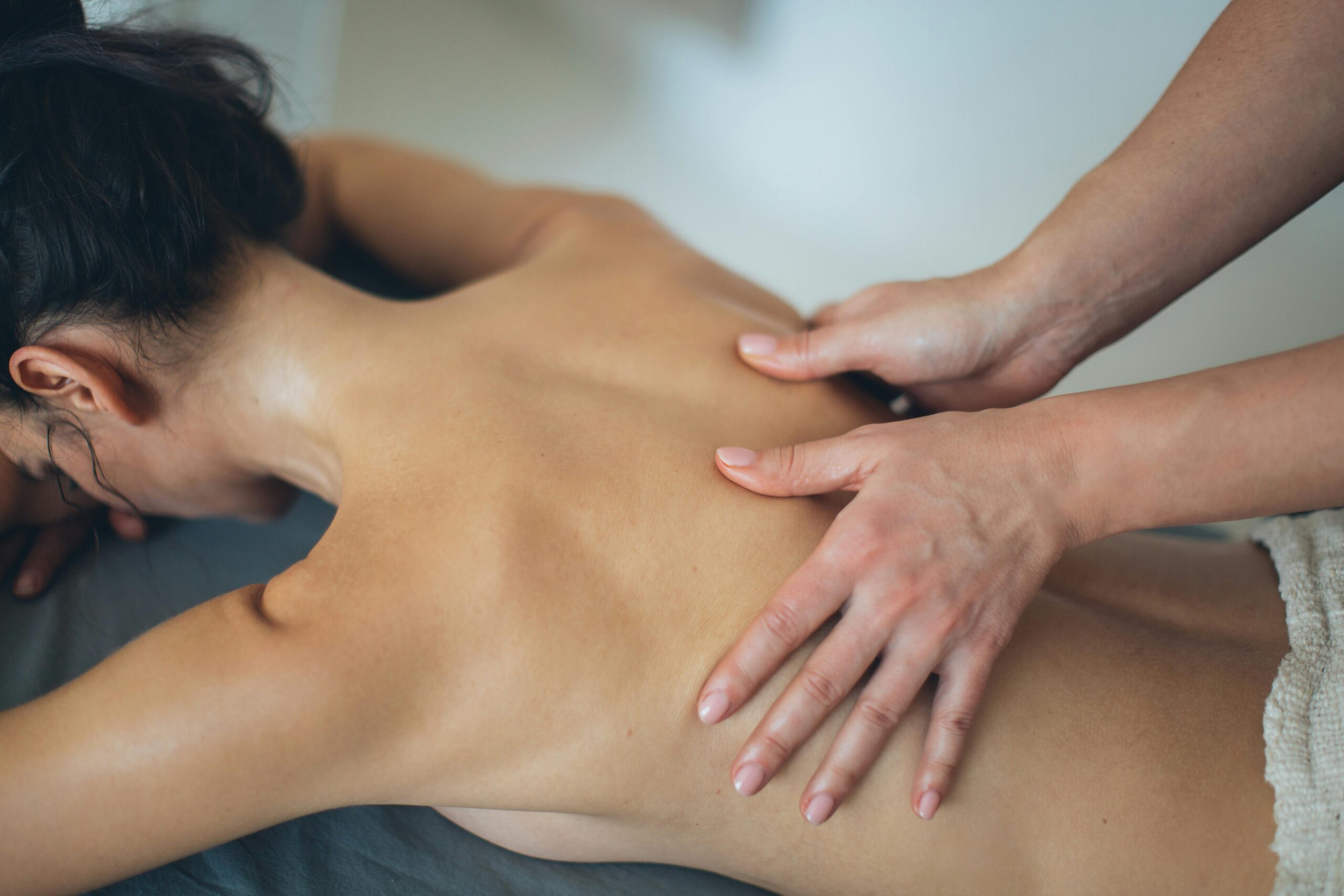 A soothing body massage session promoting wellness and relaxation in a spa setting.